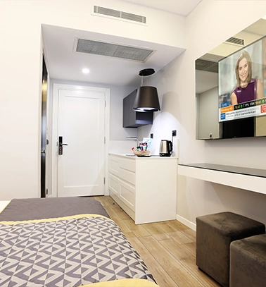 Riva Hotel room kitchen and TV